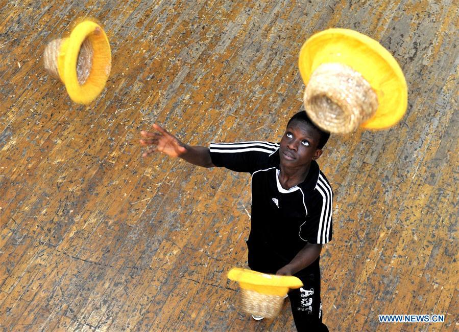 A student from Sierra Leone practises in Wuqiao Acrobatic Art School in Cangzhou, north China\'s Hebei Province, July 30, 2018. Wuqiao county is known as \