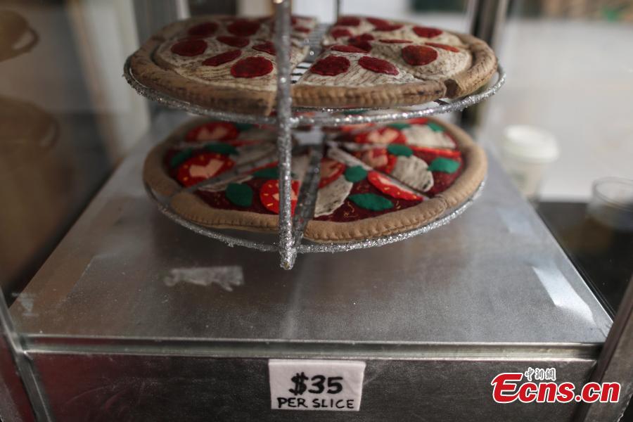 Pizza made from felt is seen at the art installation of British artist Lucy Sparrow, 32, in Los Angeles, California, U.S. July 31, 2018. (Photo/Agencies)