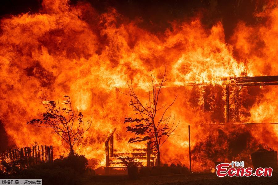 A structure burns out of control in the River Fire (Mendocino Complex) in Lakeport, California, U.S. July 31, 2018. A 70-year-old woman and her two great-grandchildren were among six people killed when a wildfire engulfed entire communities in northern California, officials and family members said. (Photo/Agencies)