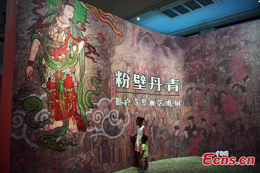Visitors look at an exhibition of murals at the Hebei Museum in Shijiazhuang City, Hebei Province, Aug. 2, 2018. The murals date back to the Ming Dynasty (1368-1644) and were from the Pilu Temple. They are known for their great composition, superb craftsmanship and rich connotation. (Photo: China News Service/Zhai Yujia)