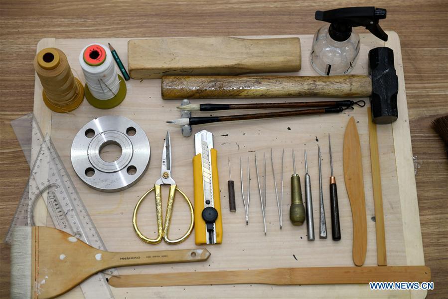 Photo taken on Aug. 2, 2018 shows some of the tools used for ancient book restoration in Shijiazhuang, capital of north China\'s Hebei Province. Gao Huiyun is a teacher of cultural relics restoration and protection at Hebei Vocational Art College. Gao has restored over 1,000 ancient books in her 13-year career time. (Xinhua/Chen Qibao)