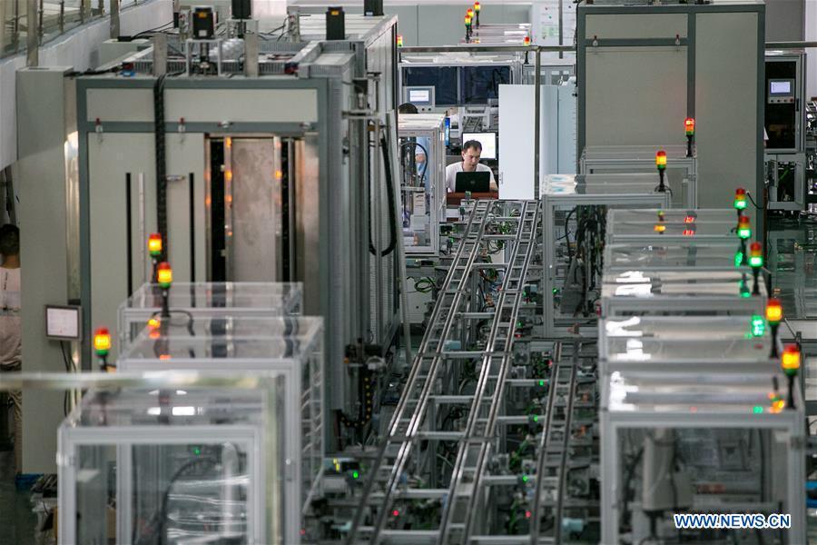 A staff member works at the Guizhou Space Appliance Co. Ltd in Guiyang, capital of southwest China\'s Guizhou Province, Aug. 1, 2018. Guizhou has become a pioneer in China\'s big data development. Big data is being widely applied in government management, business and daily life, contributing over 20 percent to the economic growth of Guizhou Province. The number of big data-related companies in Guizhou Province has grown from less than 1,000 in 2013 to more than 8,500 in 2018.(Xinhua/Li Jing)