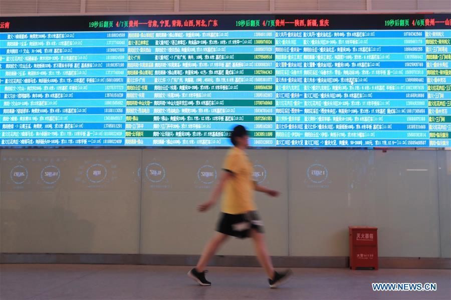 A staff member passes by the screen displaying real-time logistic information at Truck Alliance, China\'s Uber-type service for trucks, in Guiyang, capital of southwest China\'s Guizhou Province, Aug. 1, 2018. Guizhou has become a pioneer in China\'s big data development. Big data is being widely applied in government management, business and daily life, contributing over 20 percent to the economic growth of Guizhou Province. The number of big data-related companies in Guizhou Province has grown from less than 1,000 in 2013 to more than 8,500 in 2018.(Xinhua/Ou Dongqu)