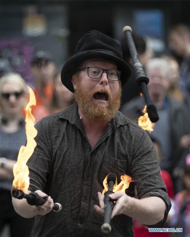 A man performs on the opening day of the Edinburgh Festival Fringe 2018 in Edinburgh, Scotland, Britain on Aug. 3, 2018. (Xinhua/Han Yan)