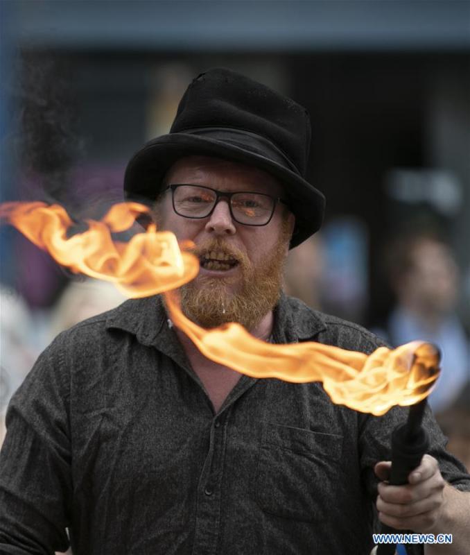 A man performs on the opening day of the Edinburgh Festival Fringe 2018 in Edinburgh, Scotland, Britain on Aug. 3, 2018. (Xinhua/Han Yan)