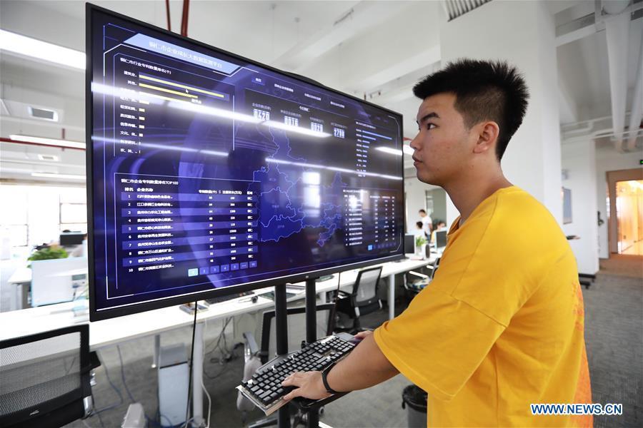 A staff member of BBD (Business Big Data) works in Guiyang, capital of southwest China\'s Guizhou Province, Aug. 2, 2018. BBD is a provider of big data solutions. Guizhou has become a pioneer in China\'s big data development. Big data is being widely applied in government management, business and daily life, contributing over 20 percent to the economic growth of Guizhou Province. The number of big data-related companies in Guizhou Province has grown from less than 1,000 in 2013 to more than 8,500 in 2018.(Xinhua/Liu Xu)