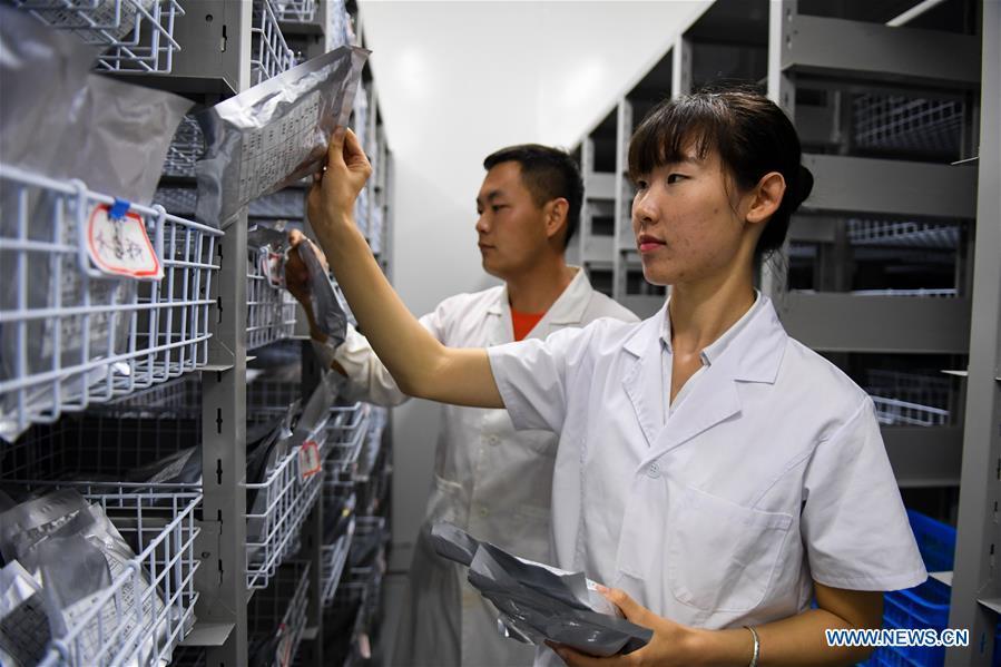 Researchers work at Elion Resources Group in Erdos, north China\'s Inner Mongolia Autonomous Region, July 11, 2018. Kubuqi, the seventh largest desert in China, is a good example of China\'s success in alleviating desertification. About 6,460 square kilometers of the Kubuqi desert has been reclaimed in the last 30 years. (Xinhua/Peng Yuan)