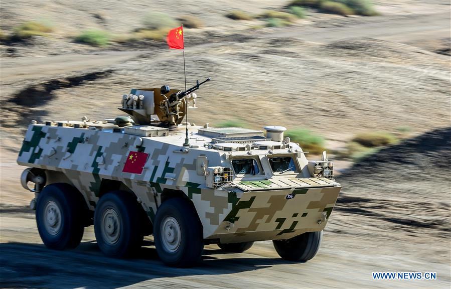 An armored vehicle operated by a Chinese crew drives during a match of the International Army Games 2018 in Korla, northwest China\'s Xinjiang Uygur Autonomous Region, Aug. 4, 2018. Three contests of the Internatio
