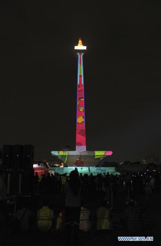 A video mapping work is projected on the facade of the National Monument also known as Monas to welcome the Asian Games in Jakarta, Indonesia, Aug. 13, 2018. (Xinhua/Zulkarnain)