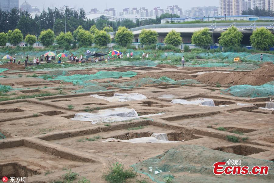 Ancient tomb clusters consisting of about 300 tombs have been found near the Beijing Olympic Sports Center in Beijing, China. The 300 tombs, discovered at a construction site, were presumably built around the Qing Dynasty (1644-1911), according to local cultural relics department. (Photo/IC)