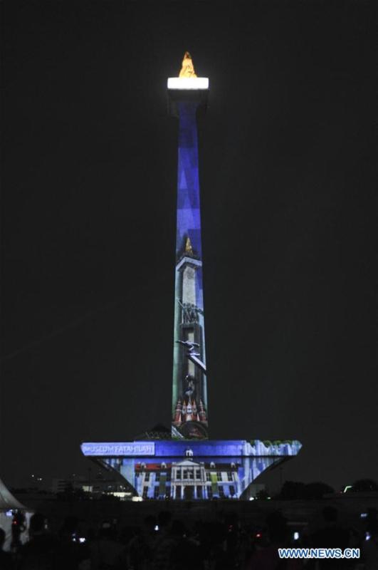 A video mapping work is projected on the facade of the National Monument also known as Monas to welcome the Asian Games in Jakarta, Indonesia, Aug. 13, 2018. (Xinhua/Zulkarnain)