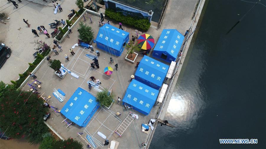 Photo taken on Aug. 13, 2018 shows temporary tents in Sijie Township of Tonghai County, southwest China\'s Yunnan Province. Eighteen people were injured after a magnitude-5 earthquake jolted Yunnan Province Monday morning, local authorities have said. The quake affected more than 48,000 residents in the counties of Tonghai and Huaning and the district of Jiangchuan, all administered by the city of Yuxi, damaging over 6,000 homes, according to a statement from the provincial civil affairs department. (Xinhua/Wang Anhaowei)