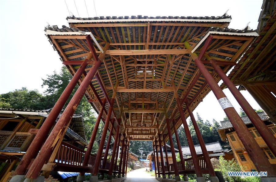 Photo taken on Aug. 14, 2018 shows a wooden bridge in Zaidang, Qiandongnan of southwest China\'s Guizhou Province. Zaidang, a village of Dong ethnic group, has encouraged its villagers to make use of idle resources to upgrade local infrastructure, in an aim to develop tourism industry and shake off poverty. (Xinhua/Wang Bingzhen)