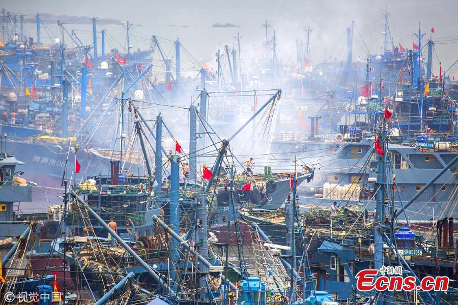 A ceremony to mark the end of a fishing ban, imposed to help increase fish stocks, at a port in Shishi City, Fujian Province, Aug. 16, 2018. Shishi boasts a large national fishing port, and a majority of the city’s ships go fishing near the Diaoyu Islands. (Photo/VCG)