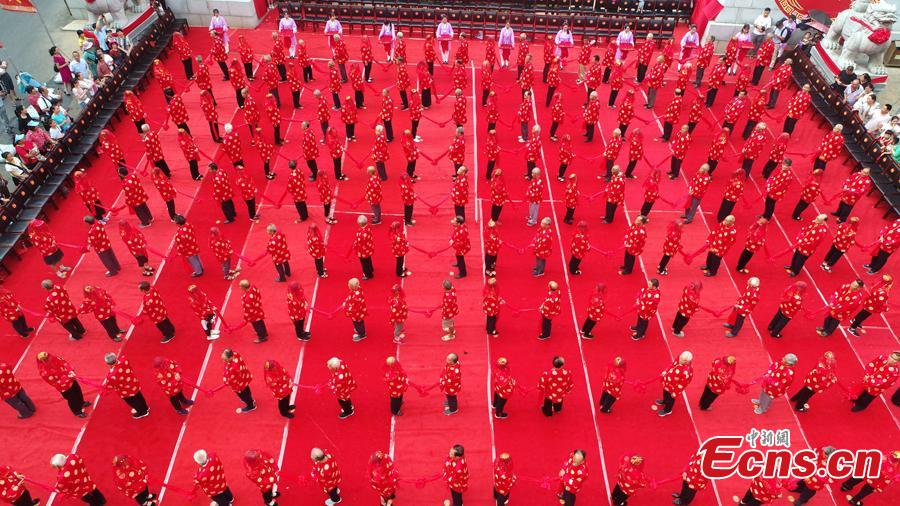 Some 101 couples attend a golden wedding anniversary celebration on Laojun Mountain in Luanchuan County, Central China’s Henan Province, Aug. 16, 2018, in the run up to Qixi Festival, known as China’s Valentine\'s Day. Falling on the seventh day of the seventh lunar month on the Chinese calendar - Aug. 17, this year - the festival celebrates the annual meeting of the cowherd and weaver girl in Chinese mythology. (Photo: China News Service/Wang Zhongju)