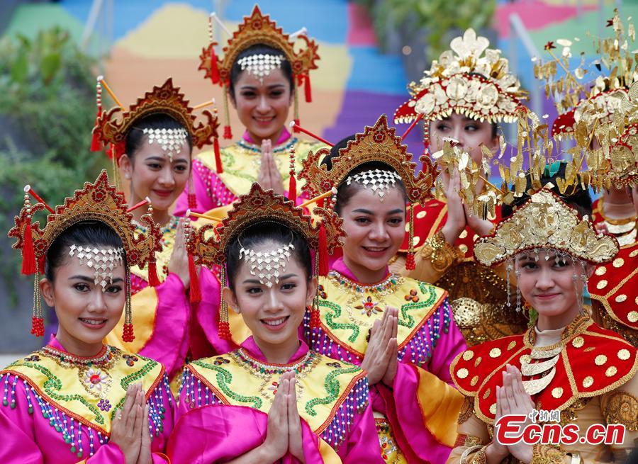 Indonesian girls don traditional costumes to attend flag-raising ceremonies at the Asian Games Village ahead of the 18th Asian Games in Jakarta, Indonesia, on Aug. 16, 2018. (Photo: China News Service/Liu Guanguan)