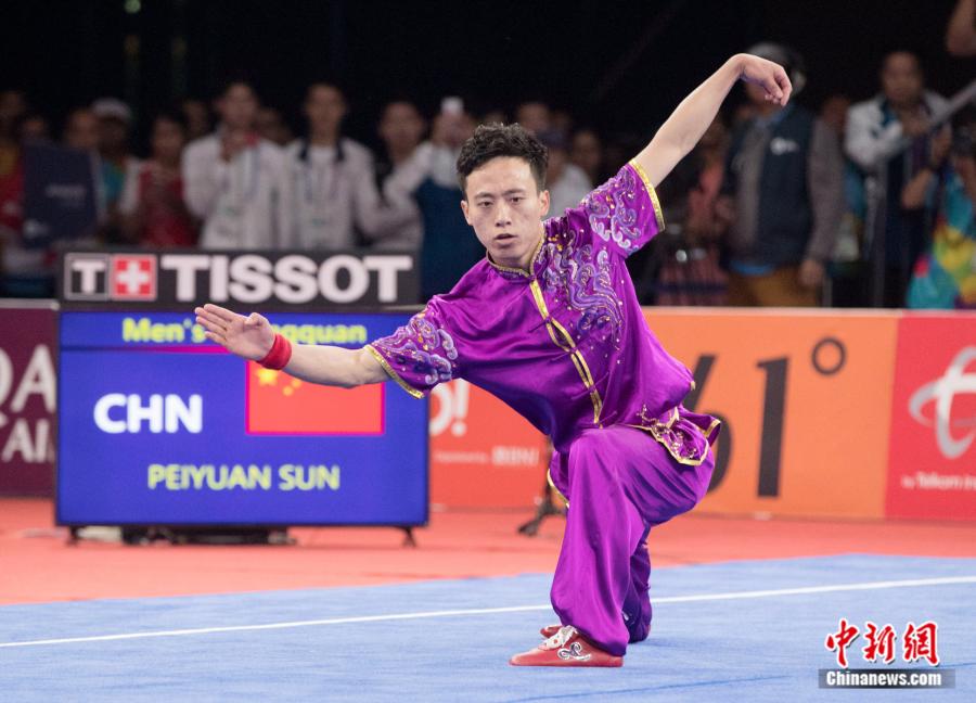 Sun Peiyuan of China competes during the Men\'s Changquan final at the 18th Asian Games in Jakarta, Indonesia Aug. 19, 2018. (Photo/China News Service)