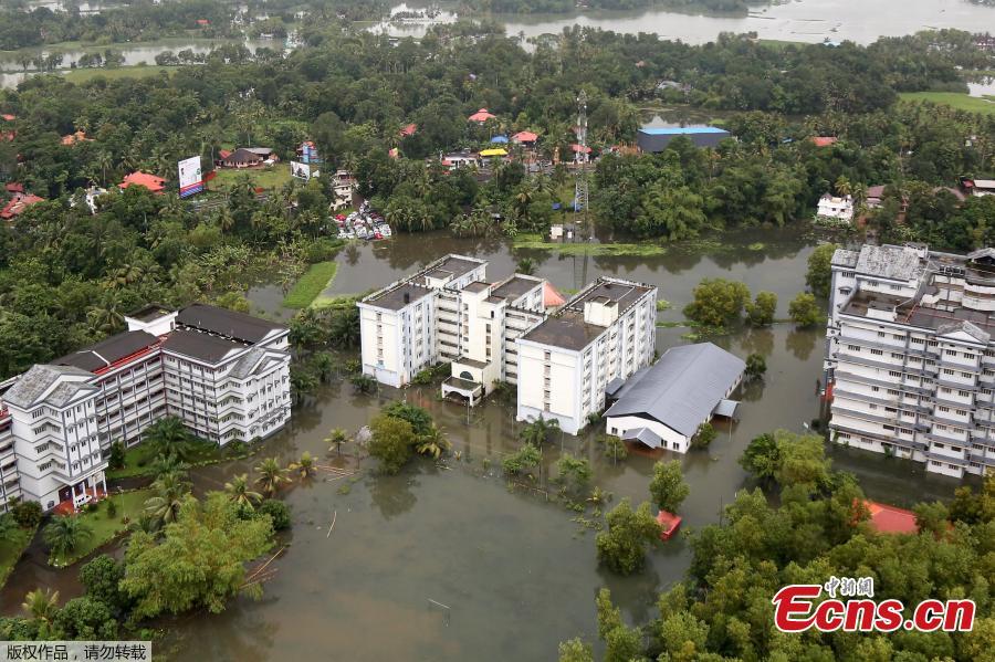 An aerial view shows partially submerged buildings at a flooded area in the southern state of Kerala, India, August 19, 2018. Incessant downpours since Aug. 8 have caused the worst floods in a century in the southwestern state, and close to 200 people have perished in the rising waters and landslides. (Photo/Agencies)