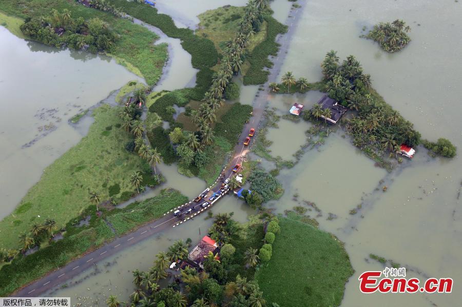 An aerial view shows partially submerged road at a flooded area in the southern state of Kerala, India, August 19, 2018. Incessant downpours since Aug. 8 have caused the worst floods in a century in the southwestern state, and close to 200 people have perished in the rising waters and landslides. (Photo/Agencies)