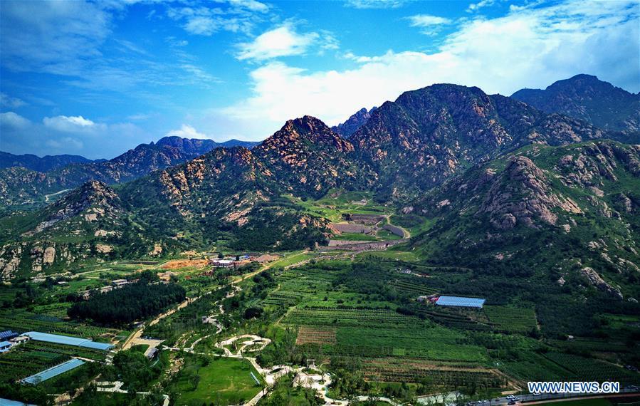 Aerial photo taken on Aug. 18, 2018 shows a park constructed on the site of an abandoned mine in Changli County, north China\'s Hebei Province. The discarded mine and damaged mountain revive as the local government has been stepping up measures to rehabilitate the ecological environment. (Xinhua/Yang Shiyao)