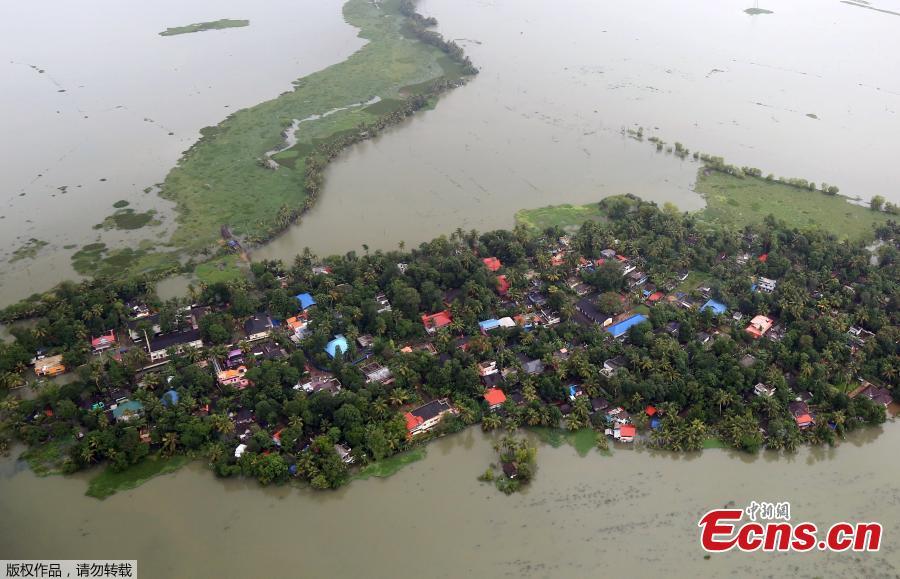 An aerial view shows partially submerged houses at a flooded area in the southern state of Kerala, August 19, 2018. Incessant downpours since Aug. 8 have caused the worst floods in a century in the southwestern state, and close to 200 people have perished in the rising waters and landslides. (Photo/Agencies)