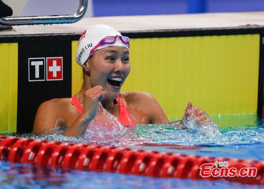 Liu Xiang of China celebrates after women\'s 50m backstroke final of swimming at the 18th Asian Games in Jakarta, Indonesia, Aug. 21, 2018. Liu won the gold with 26.98 seconds and set a new world record. (Photo: China News Service/Du Yang)