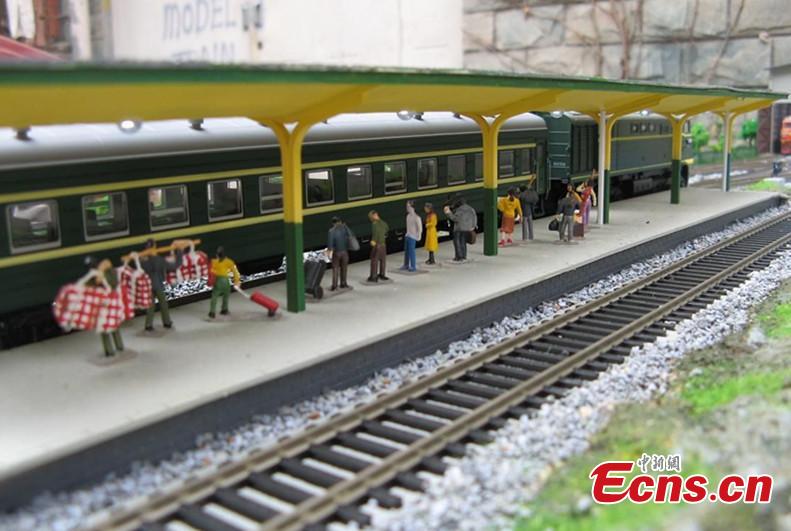 Zhang Yong’an, 63, and his family members have spent five years and more than one million yuan ($145,000) building a ‘train kingdom\' in their 330-sqm home garden in Wenjiang District, Chengdu City, Southwest China’s Sichuan Province. A great fan of train models from an early age, Zhang has tried his best to present every part of a real railway station with vivid models, including train lights, tunnels, passengers, platforms, freight trains and passenger trains. When it rains, Zhang drives all the trains indoors by remote control. (Photo: China News Service/Wu Pinghua)