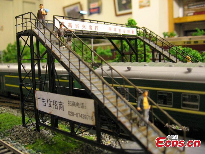 Zhang Yong’an, 63, and his family members have spent five years and more than one million yuan ($145,000) building a ‘train kingdom\' in their 330-sqm home garden in Wenjiang District, Chengdu City, Southwest China’s Sichuan Province. A great fan of train models from an early age, Zhang has tried his best to present every part of a real railway station with vivid models, including train lights, tunnels, passengers, platforms, freight trains and passenger trains. When it rains, Zhang drives all the trains indoors by remote control. (Photo: China News Service/Wu Pinghua)