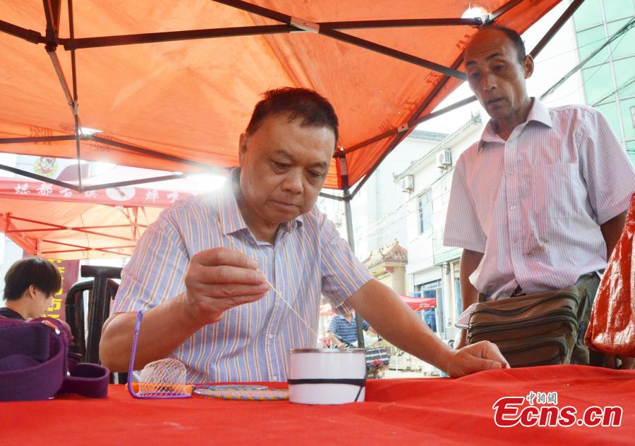 A cricket market in Sidian Town, Ningyang County, East China’s Shandong Province. The town has been famous as a source of crickets for tens of years and it’s estimated the insect has generated an annual revenue of 700 million yuan ($102 million). Wang Yingxi, who works in other cities for better-paying jobs, often comes back to his hometown to search for crickets during the season. Zhang Maolong, a 58-year-old cricket dealer, said he bought 90 crickets since July 26 and the most expensive one was 3,600 yuan. Liu Deqiang, director of a local cricket association, claimed over 200,000 dealers visited the town in the season and one cricket fetched a record of 100,000 yuan. (Photo: China News Service/Hao Xuejuan)