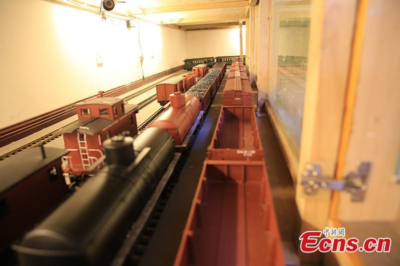 Zhang Yong’an, 63, and his family members have spent five years and more than one million yuan ($145,000) building a ‘train kingdom\' in their 330-sqm home garden in Wenjiang District, Chengdu City, Southwest China’s Sichuan Province. A great fan of train models from an early age, Zhang has tried his best to present every part of a real railway station with vivid models, including train lights, tunnels, passengers, platforms, freight trains and passenger trains. When it rains, Zhang drives all the trains indoors by remote control. (Photo: China News Service/Wu Pinghua)