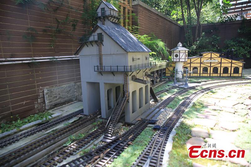 Zhang Yong’an, 63, and his family members have spent five years and more than one million yuan ($145,000) building a ‘train kingdom\' in their 330-sqm home garden in Wenjiang District, Chengdu City, Southwest China’s Sichuan Province. A great fan of train models from an early age, Zhang has tried his best to present every part of a real railway station with vivid models, including train lights, tunnels, passengers, platforms, freight trains and passenger trains. When it rains, Zhang drives all the trains indoors by remote control. (Photo: China News Service/Wu Pinghua)