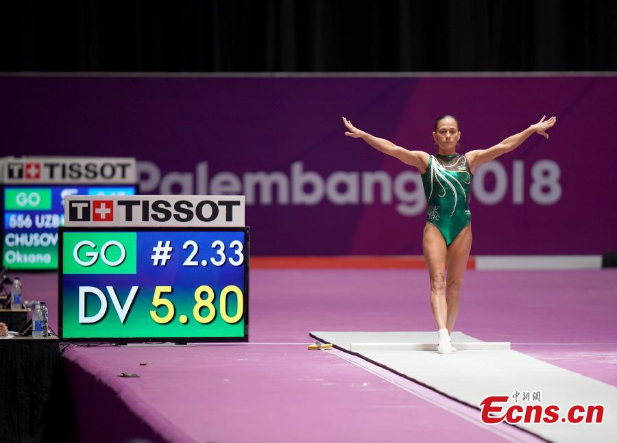 Uzbekistan\'s Oksana Chusovitina performs during the Artistic Gymnastics Women\'s Vault at the 2018 Asian Games in Jakarta, Indonesia, Aug.23, 2018. Chusovitina, 43 years old, won a silver medal in vault at the Asian Games. Chusovitina is a marvel of athletic longevity, with her international gymnastics career spanning nearly 30 years. (Photo: China News Service/Hou Yu)