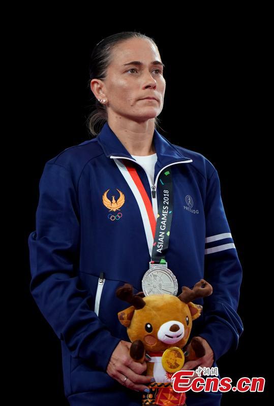 Uzbekistan’s Oksana Chusovitina celebrates after winning a silver medal in vault at the Asian Games in Jakarta, Indonesia, Aug.23, 2018. (Photo: China News Service/Hou Yu)