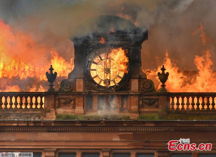 A large blaze engulfs the roof of a landmark building undergoing refurbishment in Belfast, the Northern Ireland capital, Aug. 28, 2018. The Northern Ireland Fire and Rescue Service says it was called Tuesday morning to a blaze at the Bank Buildings, home to clothing retailer Primark. Flames engulfed the roof of the structure, destroying the rooftop clock, before spreading through the five-story building. The Bank Buildings date from the late 18th century, though the current structure was built around 1900. It was nearing the end of a major renovation. (Photo/Agencies)