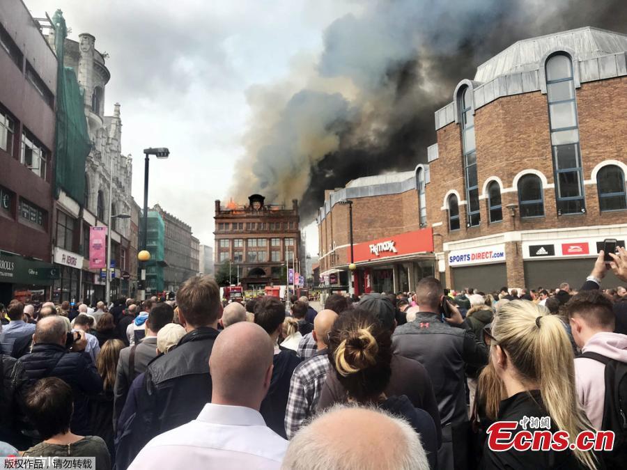 A large blaze engulfs the roof of a landmark building undergoing refurbishment in Belfast, the Northern Ireland capital, Aug. 28, 2018. The Northern Ireland Fire and Rescue Service says it was called Tuesday morning to a blaze at the Bank Buildings, home to clothing retailer Primark. Flames engulfed the roof of the structure, destroying the rooftop clock, before spreading through the five-story building. The Bank Buildings date from the late 18th century, though the current structure was built around 1900. It was nearing the end of a major renovation. (Photo/Agencies)