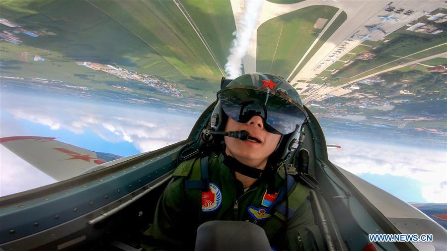 A pilot of Red Falcon Air Demonstration Team performs during an activity of opening day at the Aviation University of Air Forces in Changchun, capital of northeast China\'s Jilin Province, Aug. 30, 2018. (Xinhua/Yang Pan)