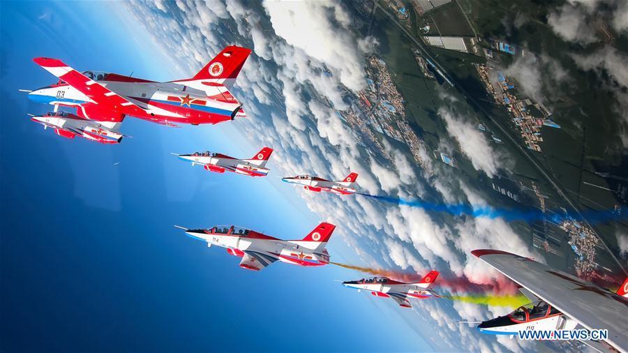 Red Falcon Air Demonstration Team performs during an activity of opening day at the Aviation University of Air Forces in Changchun, capital of northeast China\'s Jilin Province, Aug. 30, 2018. (Xinhua/Yang Pan)