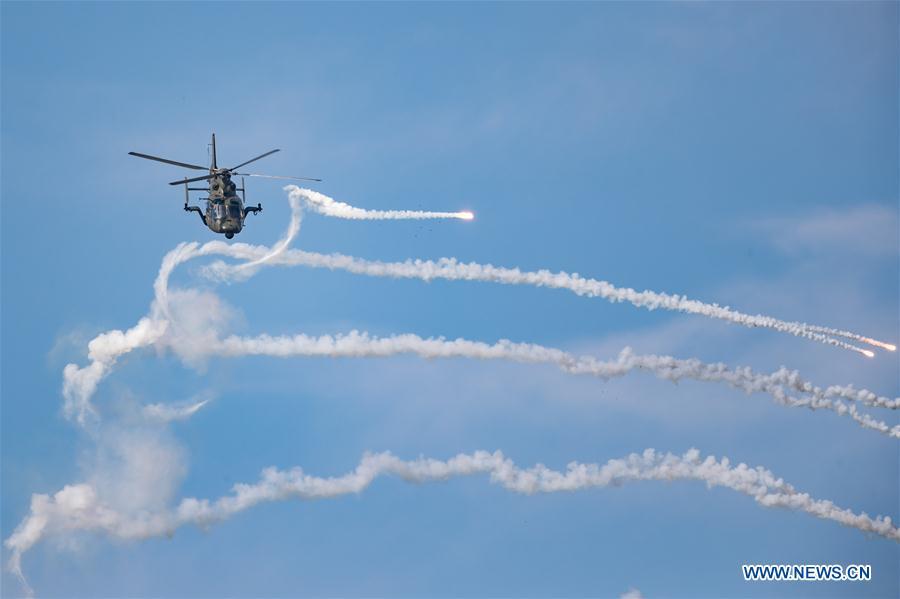 A helicopter performs during an activity of opening day at the Aviation University of Air Forces in Changchun, capital of northeast China\'s Jilin Province, Aug. 30, 2018. (Xinhua/Yang Pan)