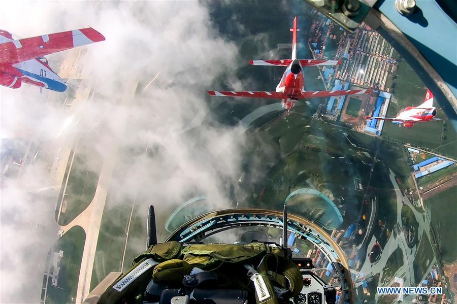 Red Falcon Air Demonstration Team performs during an activity of opening day at the Aviation University of Air Forces in Changchun, capital of northeast China\'s Jilin Province, Aug. 30, 2018. (Xinhua/Yang Pan)