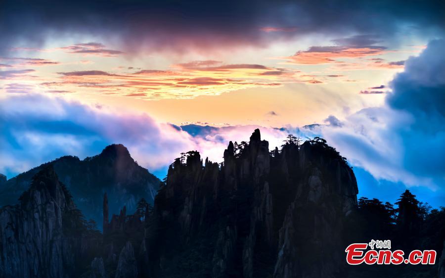 A spectacular sunrise in Mount Huangshan scenic area in Anhui Province, Aug. 30, 2018. Rolling mist between the valleys and crimson clouds created an amazing natural wonder. (Photo: China News Service/Liu Hao)