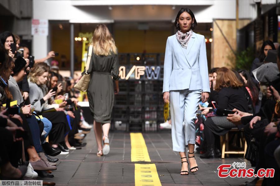 Models present the outfits on a commercial street at the Melbourne Fashion Week in Melbourne, Australia, Aug. 31, 2018. (Photo/Agencies)