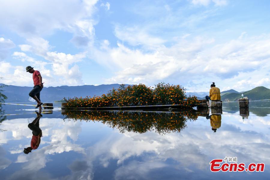 Water overflows the shores of Lugu Lake, a tourist attraction in Ninglang Yi Autonomous County, Southwest China’s Yunnan Province, Sept. 2, 2018. Local authorities have increased efforts to release more water from the lake following days of heavy rain. (Photo: China News Service/Ren Dong)