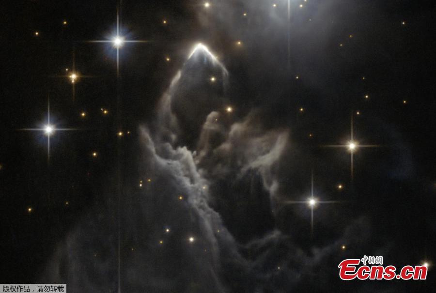 The little-known nebula IRAS 05437+2502 billows out among the bright stars and dark dust clouds that surround it in this striking image from the Hubble Space Telescope. It is located in the constellation of Taurus (the Bull), close to the central plane of our Milky Way galaxy. Unlike many of Hubble’s targets, this object has not been studied in detail and its exact nature is unclear. This faint cloud was originally discovered in 1983 by the Infrared Astronomical Satellite (IRAS), the first space telescope to survey the whole sky in infrared light. (Photo/NASA)