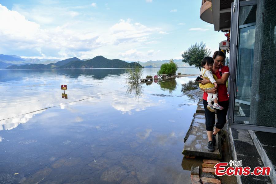 Water overflows the shores of Lugu Lake, a tourist attraction in Ninglang Yi Autonomous County, Southwest China’s Yunnan Province, Sept. 2, 2018. Local authorities have increased efforts to release more water from the lake following days of heavy rain. (Photo: China News Service/Ren Dong)