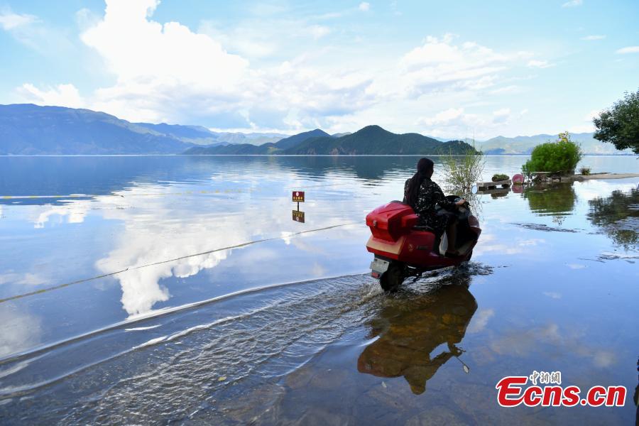 Water overflows the shores of Lugu Lake, a tourist attraction in Ninglang Yi Autonomous County, Southwest China’s Yunnan Province, Sept. 2, 2018. Local authorities have increased efforts to release more water from the lake following days of heavy rain. (Photo: China News Service/Ren Dong)