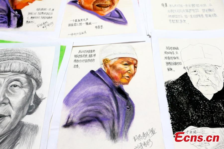 Li Fuchang shows drawings of his mother in Xi’an City, Northwest China’s Shaanxi Province, Sept. 4, 2018. Li, 60, drew more than 200 portraits of his mother before she died two years ago after becoming ill and bed-ridden. Li said he created the images to help cheer up his mother and today he feels grateful to have the record of her last days. (Photo: China News Service/Zhang Yuan)