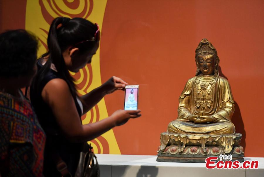 An exhibition of bronze Buddha statues opens in Shijiazhuang City, North China’s Hebei Province, Sept. 4, 2018. Hebei Provincial Museum displayed some 200 selected bronze Buddha statues made in the period from the Sixteen Kingdoms in the north (303?439) to the Qing Dynasty (1368-1644) to show the evolution of Buddhism and Buddha images in China. (Photo: China News Service/Zhai Yujia)