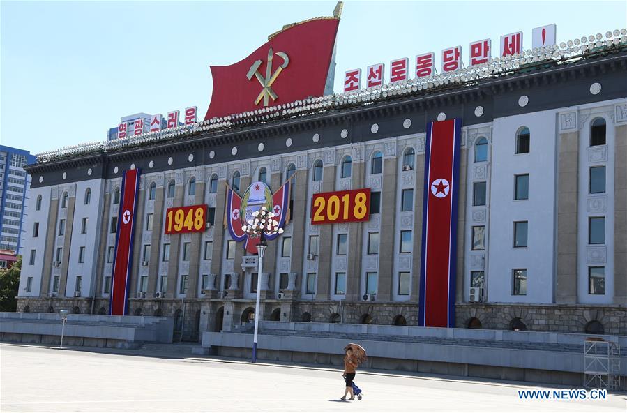 Photo taken on Sept. 8, 2018 shows a resident walking at Kim Il Sung Square in Pyongyang, capital of the Democratic People\'s Republic of Korea (DPRK). Sept. 9, 2018 marks the 70th anniversary of the founding of the DPRK. (Xinhua/Jiang Yaping)