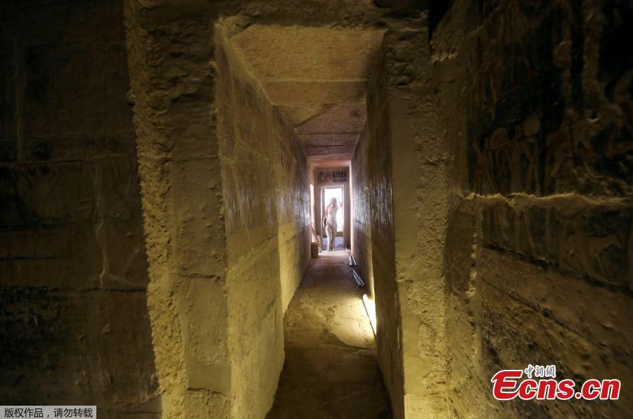 A tourist passes through the entrance of a chamber of the tomb of Mehu after it was opened for the public at Saqqara area near Egypt\'s Saqqara necropolis, in Giza, Egypt September 8, 2018. (Photo/Agencies)