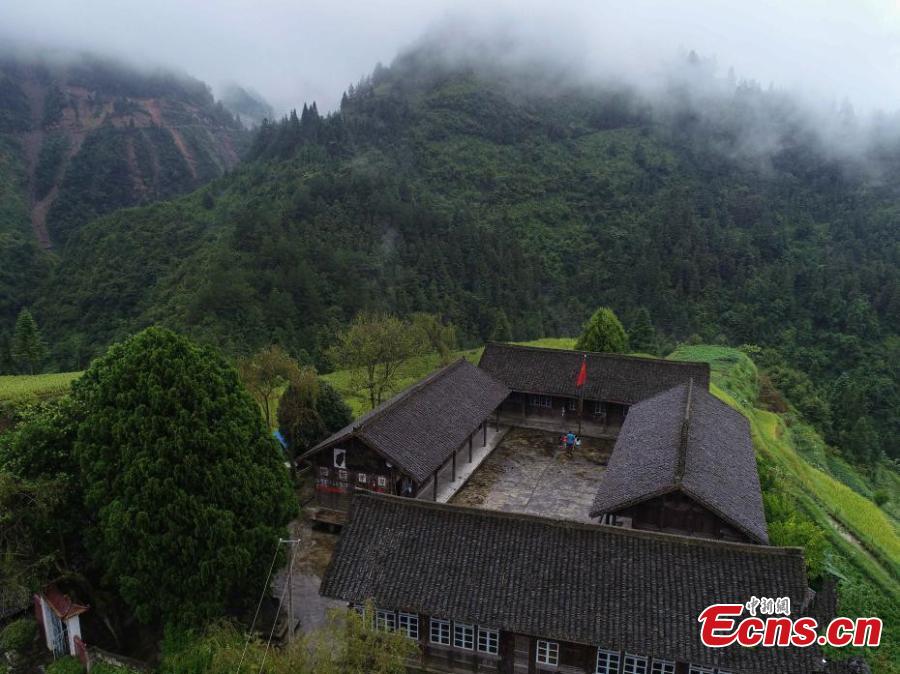 An aerial view of the mountain school in Danggan Village, Paitiao Town, Guizhou Province, Sept. 7, 2018. Yang, 40, is the only teacher in the school that has one first grader and seven pre-school children from nearby villages. If not for the school, children would have to travel to a town more than 20 kilometers away to study. (Photo: China News Service/Huang Xiaohai)